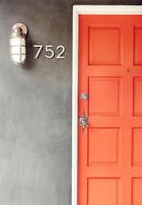 This front door should be all the proof you need to decide that when it comes to doors, orange is the new black. It might be brunch feelings talking, but the bright hue reminds me of a perfect blood-orange mimosa. Needless to say, I've personally got a little orange crush on this one.