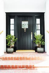This is a door we adore. There's something so stylishly simple about a classic black door and frame that reminds us it's time to step up.