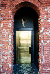 This metallic gold door shines bright to welcome guests to L.A.'s Hotel Covell. Against a backdrop of more textural, aged elements like brick walls, it's a chic, smooth, glam touch.