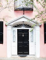 Knock, knock. Who’s there? A fresh front door color combination. It doesn't get more classic that a jet-black front door, but in this case, the blush walls give the traditional shade a trendy new twist.