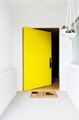 This vibrant, happy shade of yellow invites the sunshine (and sunny vibes) in. That's what makes yellow one of my favorite colors. Accessorized with a simple welcome mat and a few hanging plants, this bright door only requires minimal décor to make a big opening statement.&nbsp;