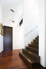 Hallway and Medium Hardwood Floor  Photo 14 of 29 in House on Tanguile Street by dito architects