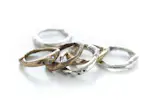 A mix and match set of bronze and silver rings.  Some even have black diamonds!