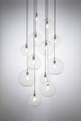 DRIFT Chandelier – Hand blown glass globes, white cane patterning, hand-blackened brass hardware, cloth cords, Edison-style LED bulbs. 

Designed and made by KEEP
Adam Holtzinger + Susan Spiranovich
