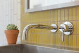 Wall mounted faucets add yet another space saving element to the bathrooms.