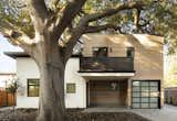 One of the most significant challenges was designing to accommodate and celebrate a 100-year old heritage tree that was centrally located on the site. Finding a way to preserve this 60’ tall and 50’ wide Coast Live Oak while creating  four new housing units was no small feat.  According to Young, “One of the biggest fears expressed by the neighbors was that the heritage tree would be removed. To preserve it, we broke the massing of the four units into two separate buildings.  We wanted the front building and single-family home to nestle under the limbs so one of the first things we did was build a 3D model of the tree and its major limbs and branches.  By working with the arborist to prune some of the secondary branches, we were able to open up the canopy to bring more light to the yard and tuck the single-family home and the 3rd floor terrace under the primary limbs.”