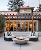 The generous outdoor living area has room for dining and relaxation.  By Arterra Landscape Architects