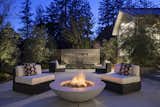 The fountain adds a pleasant sound to evening gatherings.  By Arterra Landscape Architects