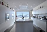 The kitchen. by Archlinea. Special made Forno per la Pizza, atural oak boiserie, with Carrara Marblen