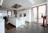 The kitchen. by Archlinea. Special made Forno per la Pizza, atural oak boiserie, with Carrara Marble