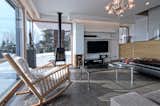 Living room corner window. Concrete floor, special made furniture in natural oak and lacquered mdf fiber. Gervasoni Rocking Chair, Sofas by Cassina