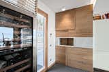 The kitchen. by Archlinea. Special made Forno per la Pizza, atural oak boiserie, with Carrara Marble