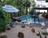 View of the backyard of the house (lap pool, jacuzzi and the upstairs terrance)