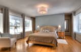 Bedroom Master bedroom  Photo 7 of 23 in Prairie School Inspired Stone Home on the Golf course by Luc Bedard