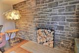 Stone fireplace (one of two)  Photo 14 of 23 in Prairie School Inspired Stone Home on the Golf course by Luc Bedard