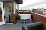 Private soaking tub on rooftop deck