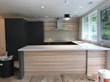 Kitchen during construction.  Poggenpohl cabinets customized with ash shelves.