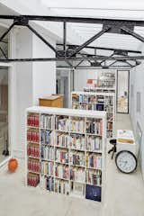 To house the family's extensive book collection, the team replaced a leaky fiberglass roof above an existing "winter garden" with an insulated glazing system. "This allowed year-round library use and improved daylighting," adds the firm.