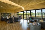 Inside the tasting room, floor-to-ceiling windows allow natural light to fill the room and provide stunning views. Photo by Andrea Johnson. Read more about the design of the winery at imbibemagazine.com/modern-winery-design-sokol-blosser