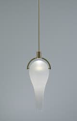 Shown here in a non-directional brass finish, the Airon Glow pendant can also be shipped with a blackened-brass finish.