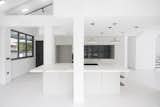 Existing columns frame the large island kitchen.