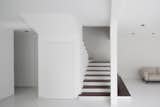 Staircase and discrete storerooms.