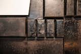 Dark patinated baking sheets received a second life as a wall décor and lamp shades.