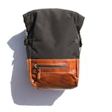 When we first saw the Roll-Top Backpack from 1.61 Soft Goods it was love at first sight. We immediately reached out to founders Westley Nunn and Diana Wu, asking if they’d consider doing a special limited edition for FvF. Wes and Diana immediately agreed, and what followed was an extensive, detailed correspondence in which we worked together to refine their already amazing design to our vision.
Starting with their original design--a bag that combined elements of a trek pack with an urban commuter pack--we reduced the volume to be more unisex friendly, stripped away elements such as the waist belt, updated the interior for better visibility, and enhanced the bottom with full grain leather.
The resulting backpack maintains the core technical features of their original, with the added effect of becoming more approachable. The bag also includes a floating cross-dyed white polyester liner with a padded laptop sleeve, main seams bound for extra strength, water bottle or U-lock holders on both sides, strap keepers for the shoulder straps, and load lifters.
In terms of accessibility, the backpack features four waterproof zippers to provide multiple opportunities for storage: one zipper to access the main compartment from the right side of the pack, one above the head, one on the bottom front of the pack (for keys or a phone), and the last, a long pocket on the left side.