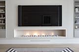 At just over 2.5 meters long this stunning fireplace is lined in limestone with the platonic fire pebbles completing the picture.