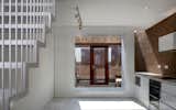 Kitchen, Brick Backsplashe, and Marble Floor  Photo 10 of 10 in Brick-A-Brack House by Urban-Agency Architects