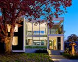 Exterior, Stucco Siding Material, Metal Roof Material, Vinyl Siding Material, Glass Siding Material, House Building Type, Metal Siding Material, Wood Siding Material, Flat RoofLine, and Concrete Siding Material  Photo 2 of 22 in Court House by KUBE Architecture