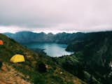 Descending the unknown summit to a break in the clouds, we breathe a sigh of relief that the battering is completed. Stretch our legs towards the edges of the tent, stripping our soaked, dust-covered socks.   Photo 2 of 12 in Indonesia: June 2016 by Haley Littleton