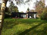 5. Danish Summerhouse. Gribskov, Denmark
What’s more natural than a black and white summer home in the Danish Riviera? This sunny Scandinavian beauty fits elegantly into its picturesque surroundings, also home to the UNESCO site of King Christian V’s royal hunting grounds.