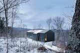 Bolton Residence. Quebec, Canada
Architect: _naturehumaine
This cantilevered home floats among the trees on a rugged plot of wooded land in Quebec’s Eastern Townships. Clad in a black steel skin, the scenery becomes a silent black and white picture in winter.  Search “naturehumaine”