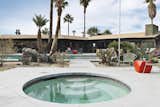 Outdoor, Large Patio, Porch, Deck, Plunge Pools, Tubs, Shower, Hardscapes, Wood Fences, Wall, Post Lighting, Concrete Patio, Porch, Deck, Lap Pools, Tubs, Shower, Concrete Pools, Tubs, Shower, Trees, and Front Yard  Photo 2 of 11 in The Wheelhouse by BoutiqueHomes