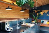 Kitchen, Metal Counter, Metal Backsplashe, Cooktops, Range, Drop In Sink, and Pendant Lighting  Photo 5 of 7 in Lake Island Cabin by Boutique