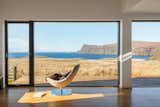 The living room of Wood H by Dualchas Architects has a sweeping view of the surrounding landscape and the Atlantic Ocean.