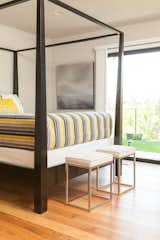 Master bedroom with modern 4-post bed.