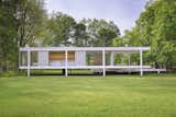 Pictured is the rear of the Farnsworth House, designed by Ludwig Mies van der Rohe. The home's structure is based on three horizontal steel planes lifted out of nature.&nbsp;