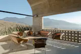 Homeowner Paul Vanden Bout's favorite spot in the home is the terrace overlooking the Sierra Norte mountains. Here, he and wife Rachel Vanden Bout enjoy a nightly ritual of taking in the view over a cocktail.