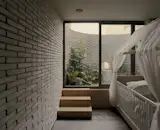 The home's interior gardens were planted to attract hummingbirds, butterflies, and other wildlife, creating a landscape where the family's children can explore and discover nature just outside their door.