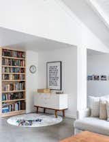 A "book nook" and play space connects the living room with the kitchen/dining area.