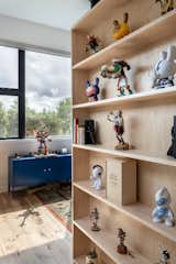 Behind the hidden bookcase door, the office of the owner (a graphic designer who works from home) opens up to an inspiring river canyon view.