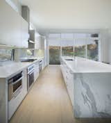 Kitchen, Marble Counter, White Cabinet, and Light Hardwood Floor  Photo 8 of 53 in Dwell by Telly Banks from Black Magic