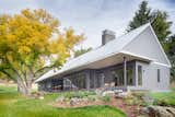 This home has an axis that connects the program of kitchen, dining, living and sleeping under a single extended roof form. 