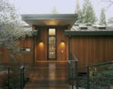 Custom walnut front entry doors  Photo 9 of 9 in New Peninsula Residence by Kaplan Architects