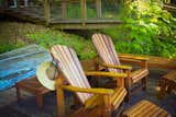 deck chairs on the dock closest to the river  Photo 2 of 3 in eco friendly flooring for a summer cabin by Communique design