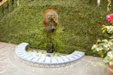 Aztec relics built into the water fountain.