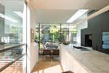 Kitchen, Marble Counter, White Cabinet, Pendant Lighting, and Medium Hardwood Floor Kitchen & Internal Courtyard  Photo 6 of 8 in Residence K&S by Open Studio Architecture