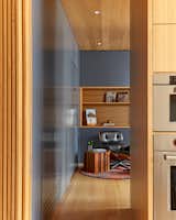 The study's narrow entrance allows for privacy from the kitchen area, while simultaneously creating a sense of connection.